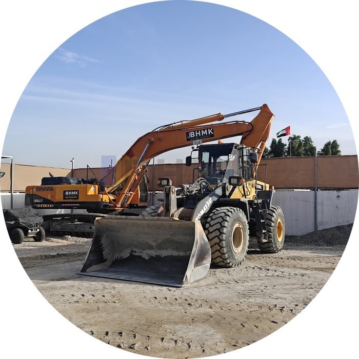 BHMK wheel loader and excavator rental fleet parked at the yard in Sharjah