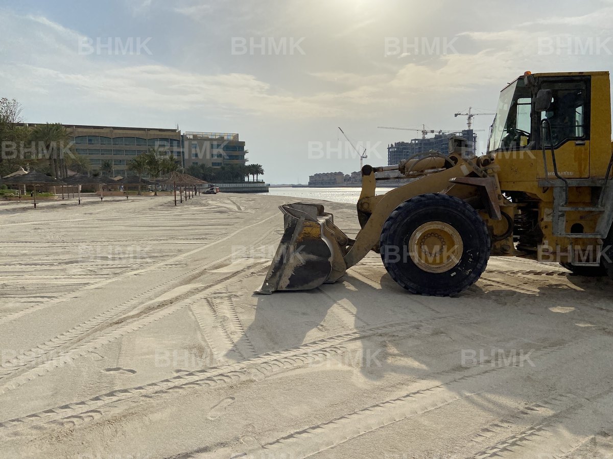 BHMK excavator placing washed beach sand during nourishment works in Dubai