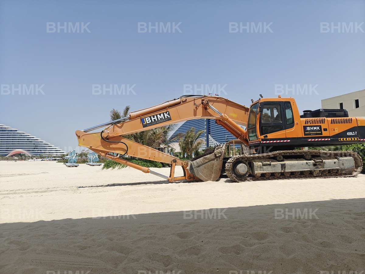 BHMK Komatsu WA380 loader levelling beach sand opposite Ain Dubai