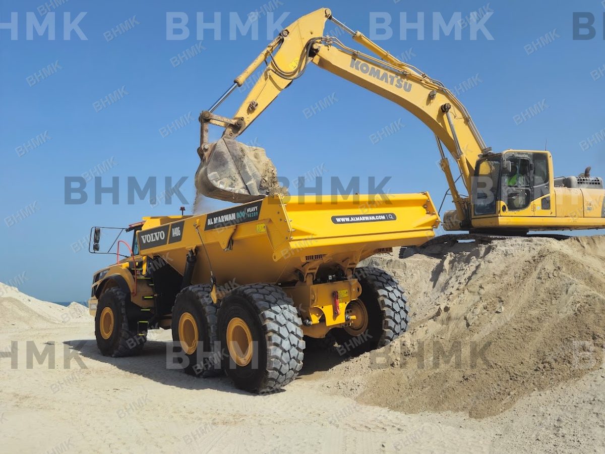 BHMK excavator working beside Dubai marina waters
