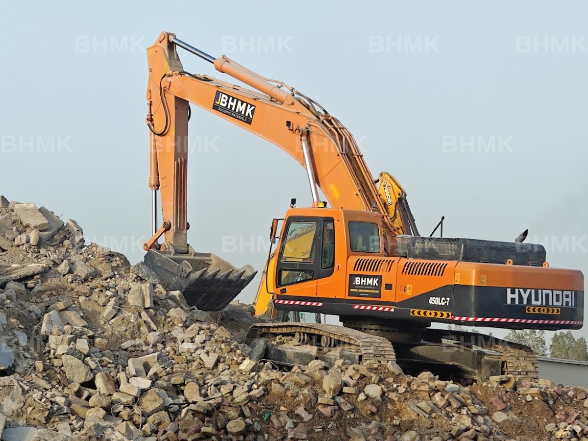 BHMK Hyundai 450LC-7 excavator breaking out demolition material in Dubai