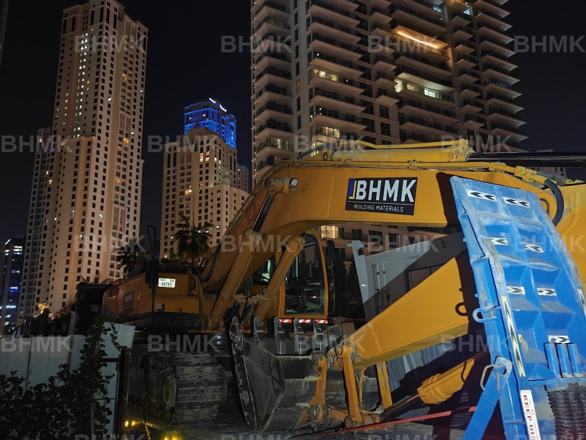 BHMK excavator mobilised on a low-bed for night works at JBR, Dubai